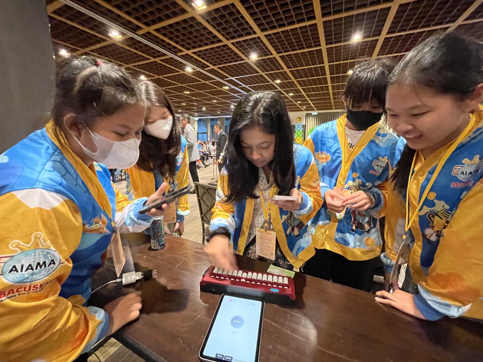Abacus Olympiad competitors exploring the Undugu smart abacus at AIAMA 2026