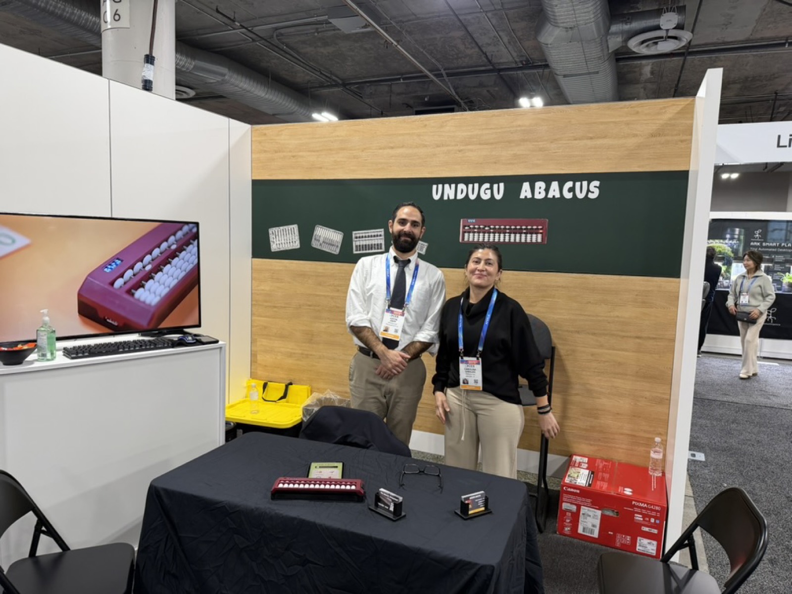 Visitors trying the Undugu smart abacus at CES